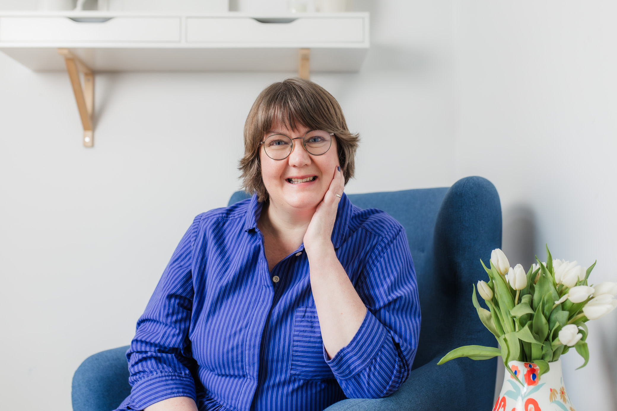 Jane Wilson in blue dress smiling at the camera