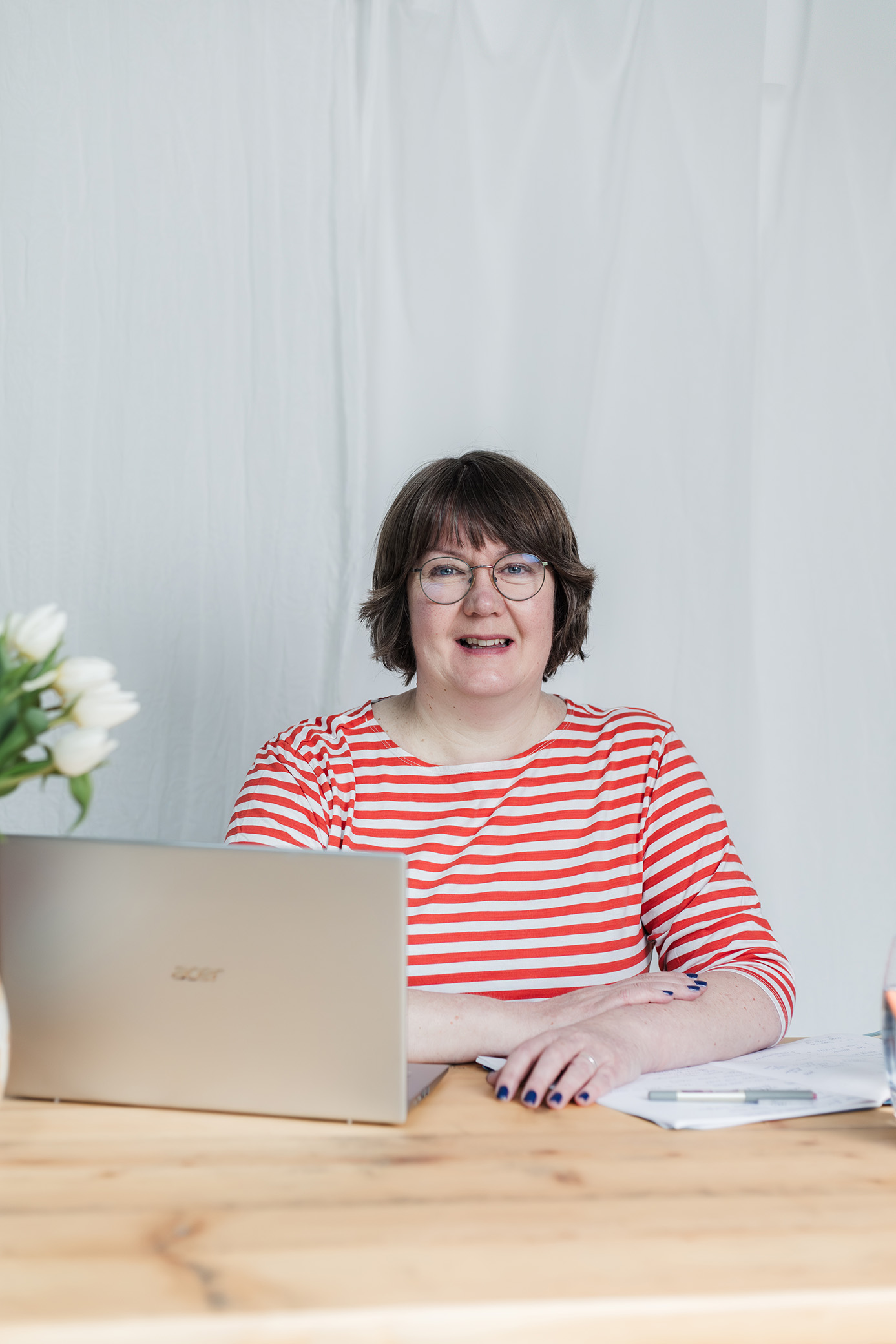 Jane Wilson HR Mentor woman in red stripe tshirt and glasses