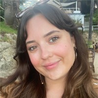 Rio Chapman with long dark hair smiling